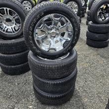 4x Bridgestone 275 55 20 Tires On Aluminum Rims