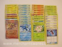 Assorted Pokemon Cards including Foil Ninetales, Foil Entei, Foil Dragonite, Foil Charmeleon, and