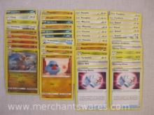 Assorted Pokemon Cards including Foil Dragonite, Foil Charmeleon, Foil Growlithe, Foil Lucario and