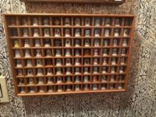 Collection of thimbles in cabinet.......Shipping