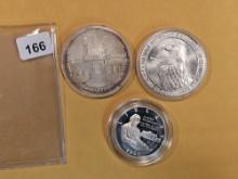 Two Commemorative Silver Dollars and a Commemorative silver half