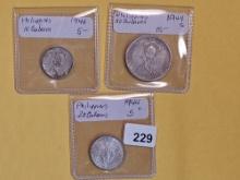 Three silver coins from the Philippines