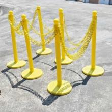 6 Yellow plastic stanchions with plastic yellow chain