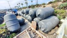 Approx.25 large black buoys