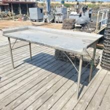 Stainless steel table 38in tall 75in wide 30in depth