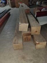 Stack of 4x4 Wood Beams with Hooks.