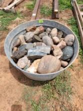 various rocks and metal bucket