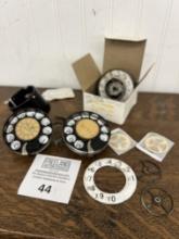 Group of antique telephone dials and parts