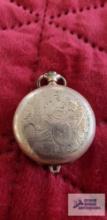 Gold colored pocket watch, needs repaired