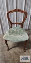 Antique boudoir chair with wooden frame