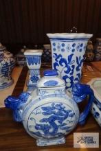 Blue and white oriental design vase, candle holder, and teapot