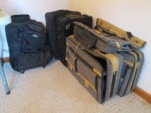 Three Black Rolling Suitcases and Two Sweet 3 Piece Tweed Suitcase Sets