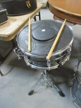 Evans Snare Drum on Stand, CB700 Drum Pad, and Pair of Vic Firth Drumsticks
