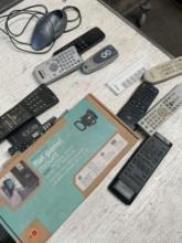 TV mount, assorted remote controls, mouse. 13 pieces