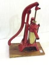 Red Paint & Brass Pump Mounted on Board