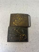 two Coca Cola brass nude lady belt buckles