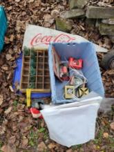 Tote of vintage Coca-Cola bottles, ornaments, banners anr antique bottle tray