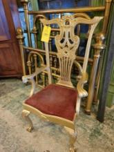 Antique claw and ball sitting chair with gold paint