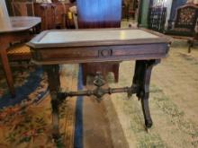 Antique Victorian parlor table/desk with marble top and spoon carved base